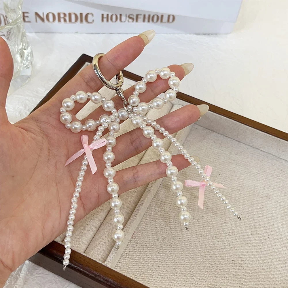 2026 New Korean Fashion Sweet Pearl Bow Keychain, Pearl Bow Keychain – Elegant Coquette Bag Charm with Pink Ribbon